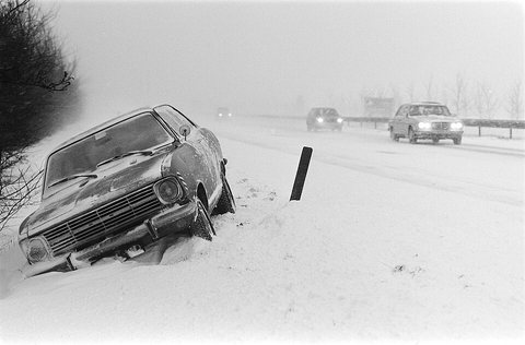 Car stranded in the snow on a motorway, 31 December 1978
